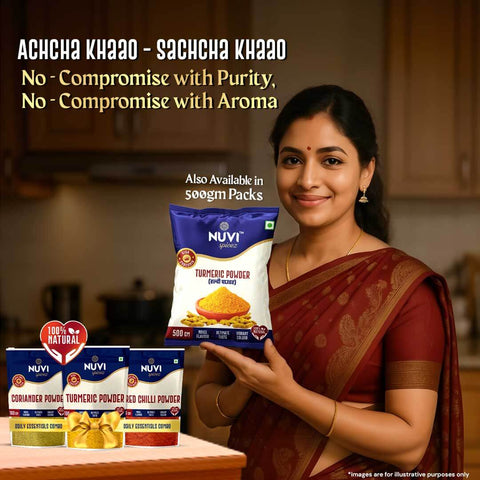 Happy woman holding Nuvi Spicez turmeric powder with coriander and red chilli powder bags in kitchen backdrop.