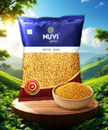 Nuví Methi Dana pack and bowl of fenugreek seeds in a scenic landscape, representing premium quality ingredients.