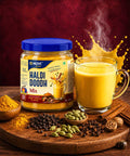 Packaged NUVI Spicez Haldi Doodh Mix with a glass of turmeric milk and spices on a wooden board.