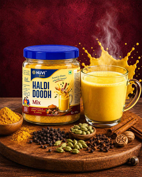 Packaged NUVI Spicez Haldi Doodh Mix with a glass of turmeric milk and spices on a wooden board.