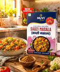 Sabzi Masala Powder package alongside a vibrant vegetable dish, highlighting rich spices and flavors.
